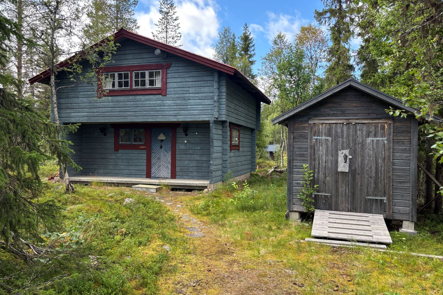 Huset med skotergarage
