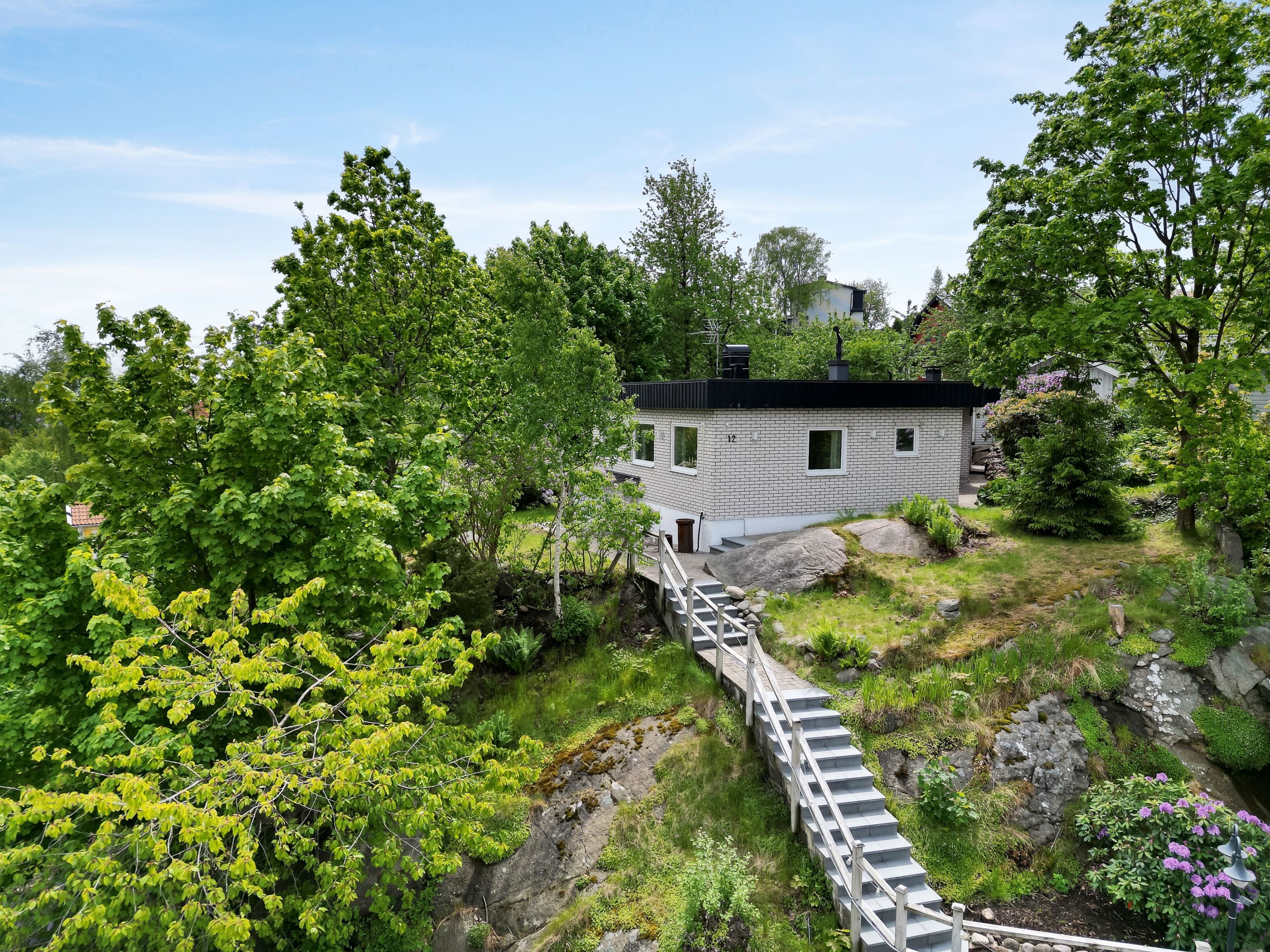 Trättebäcksliden en villa i grönska